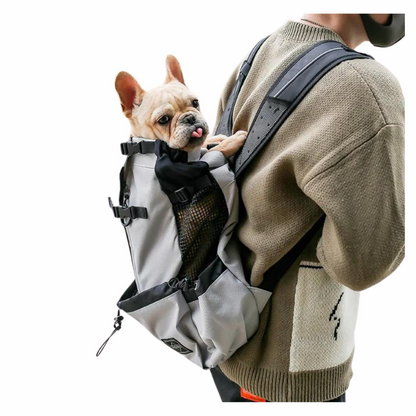 Man Carrying a dog in the Breathable Dog Backpack